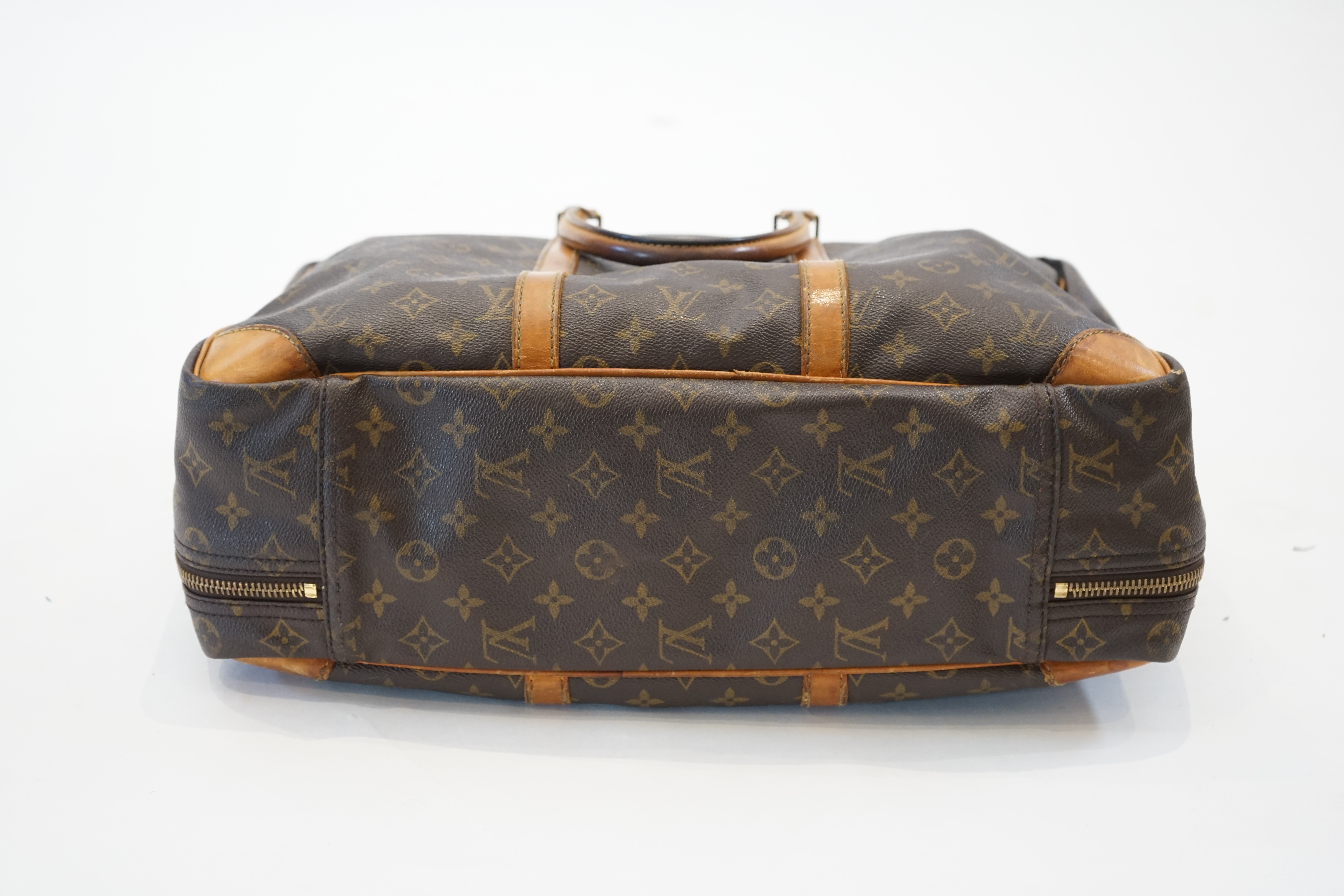 A Louis Vuitton Keepall leather travel bag with luggage tag width 13cm, length 45cm, height 30cm